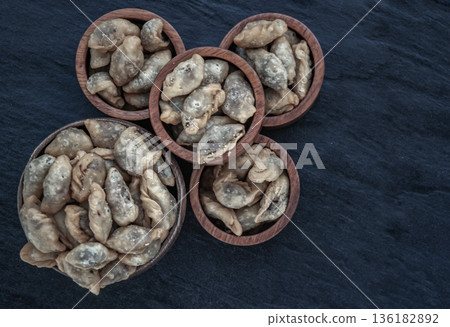 Pansib pastry stuffed in wooden cup, Thai style dumplings stuffed, thai dessert, kind of snack. Pansib pastry stuffed in wooden cup, Thai style dumplings stuffed, thai dessert, kind of snack. 136182892