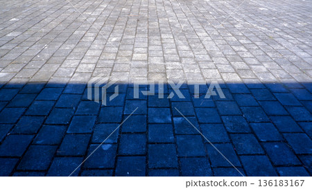 Horizontal Shadow Line on Outdoor Paving Stone Surface Horizontal Shadow Line on Outdoor Paving Stone Surface 136183167