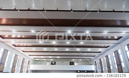Spacious Assembly Hall Interior with Symmetry and Linear Lighting Spacious Assembly Hall Interior with Symmetry and Linear Lighting 136183170