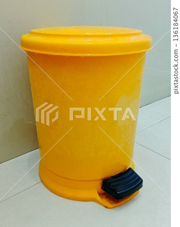 close-up photo of yellow trash can close-up photo of yellow trash can 136184067