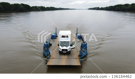 White Van on Ferry Crossing Wide River Under Overcast Sky with Green Trees on Both Sides 136184462