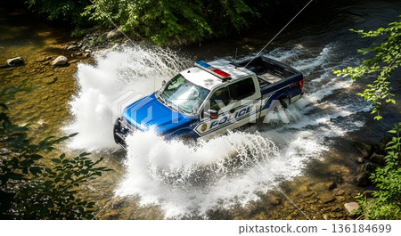 Police Truck Forcing Through River Creating Water Splashes in Natural Environment 136184699