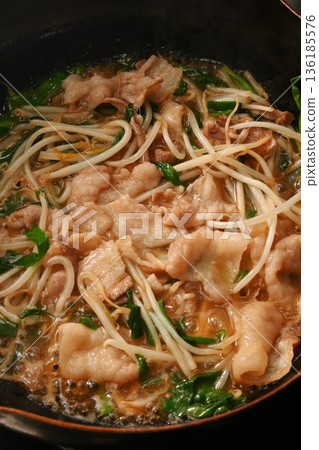 Pork chive bean sprouts being cooked 136185576