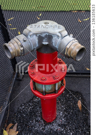 Hydrant with water hoses and fire extinguish equipment. Hydrant with water hoses and fire extinguish equipment. 136185633