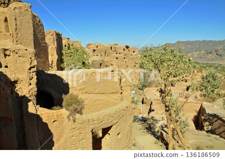 Iran, Silk Road, ruins near Yazd, Hanaq Citadel ruins, multi-story adobe building 136186509