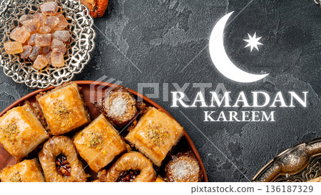 Celebrating Ramadan with traditional sweets and treats displayed on a table 136187329