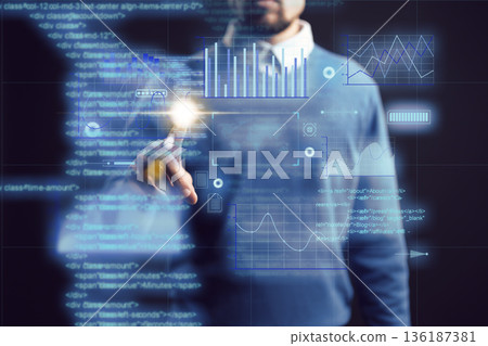 Man interacts with data visualizations and reports on a digital screen in a dark room Man interacts with data visualizations and reports on a digital screen in a dark room 136187381