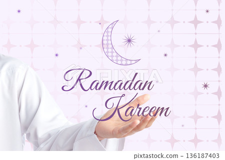 Celebration of Ramadan with a hand showing greetings and a crescent moon design 136187403