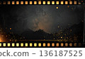 Dark vintage movie film frame with flying gold particles 136187525