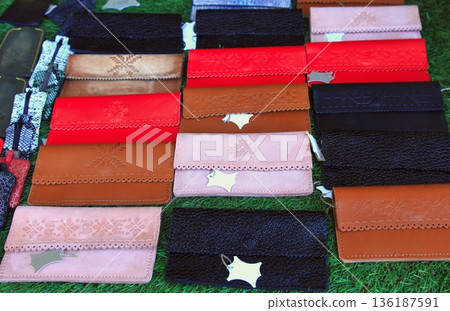 Colored genuine leather wallets in a gift shop. Colored genuine leather wallets in a gift shop. 136187591