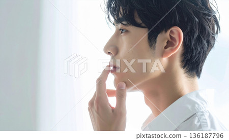 A young man's face with a blue beard and unshaved areas. Close-up of the mouth and chin. Men's skin care, beauty, and hair removal image. A young man's face with a blue beard and unshaved areas. Close-up of the mouth and chin. Men's skin care, beauty, and hair removal image. 136187796
