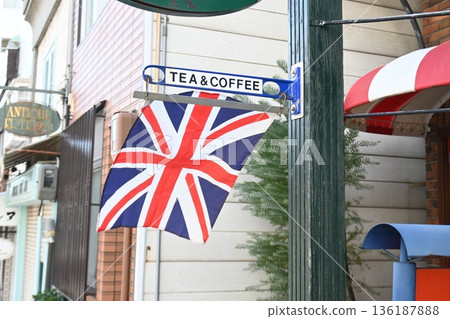 A corner tea and coffee shop draped with the British flag 136187888