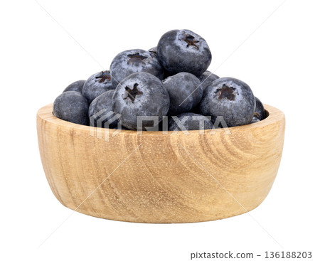 Blueberries in a wooden bowl isolated on white background 136188203