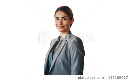 A business woman stands confidently in a sleek office environment. She is dressed in a professional suit, smiling at the camera while surrounded by glass walls and contemporary decor. A business woman stands confidently in a sleek office environment. She is dressed in a professional suit, smiling at the camera while surrounded by glass walls and contemporary decor. 136189017