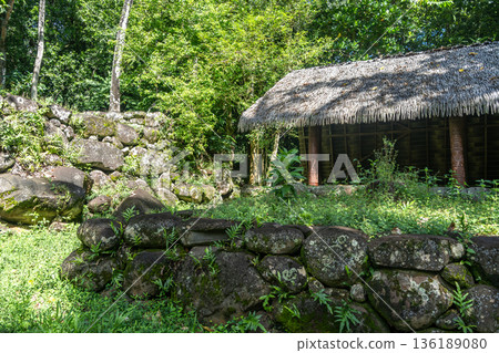 Thatched-roof building at Kamuihei archaeological site, Nuku Hiva, Marquesas Islands. French Polynesia Thatched-roof building at Kamuihei archaeological site, Nuku Hiva, Marquesas Islands. French Polynesia 136189080