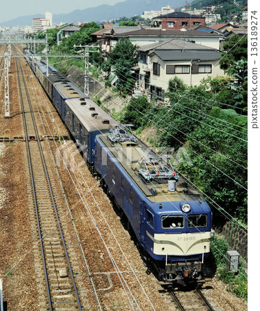 1983: A freight train pulled by an EF58 locomotive runs near Ashiya Station 1983: A freight train pulled by an EF58 locomotive runs near Ashiya Station 136189274