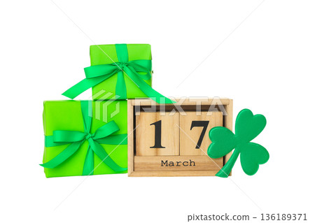 Green gifts with ribbons and a March 17 calendar, isolated, PNG 136189371