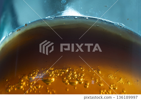 Artisan Fermentation Scene Showing Probiotic Beverage With Glowing Bubbles And Contrasting Backlight 136189997