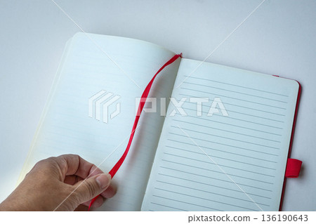 Open lined notebook with red bookmark Open lined notebook with red bookmark 136190643