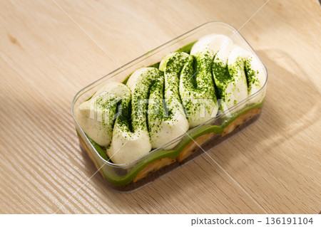 Matcha Banoffee Dessert with Banana and Cream in Soft Natural Shade Matcha Banoffee Dessert with Banana and Cream in Soft Natural Shade 136191104
