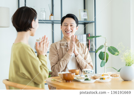 A middle-aged couple having a meal at home A middle-aged couple having a meal at home 136191669