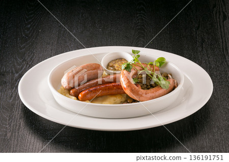 Vienna sausages served on a white plate Vienna sausages served on a white plate 136191751