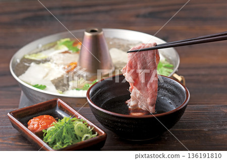 Picking up shabu-shabu meat with chopsticks Picking up shabu-shabu meat with chopsticks 136191810