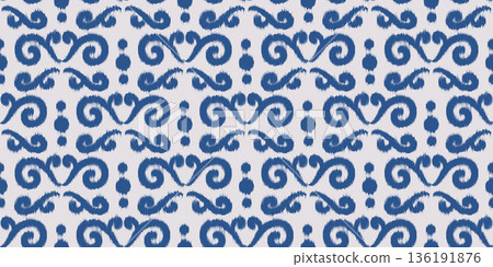 Ikat ethnic seamless pattern. Abstract blue floral print. Rug textured traditional oriental ornament for textile and fabric. Decorative trendy dye background. Ikat ethnic seamless pattern. Abstract blue floral print. Rug textured traditional oriental ornament for textile and fabric. Decorative trendy dye background. 136191876