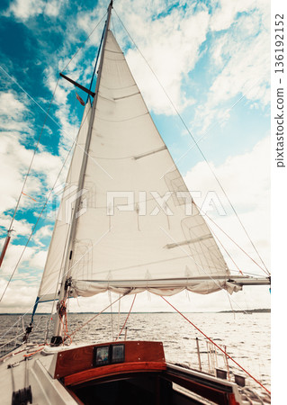Yachting on sail boat during sunny weather 136192152