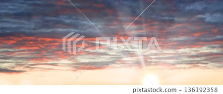 Bright clouds in the evening sky 136192358