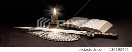 Book with sword and shield 136192401