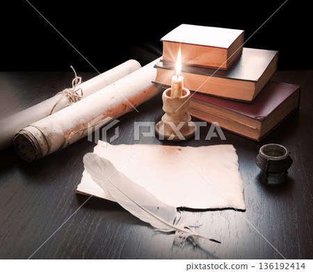 Books and candle on the table Books and candle on the table 136192414