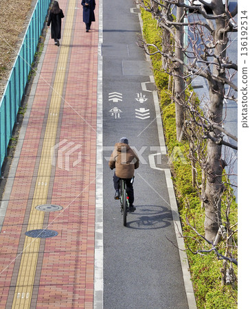 Sidewalks with separate lanes for bicycles and pedestrians Sidewalks with separate lanes for bicycles and pedestrians 136192514