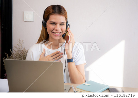 Professional young business woman working and meeting online in modern home office. 136192719