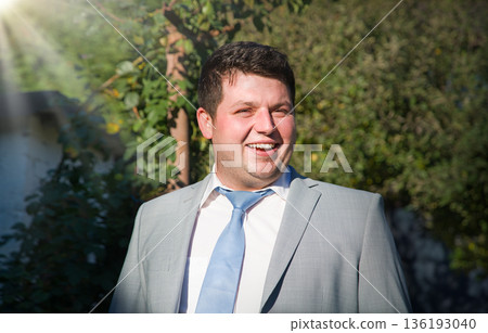 Smiling man in the park 136193040