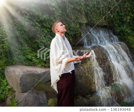 Young guy at old waterfall 136193048