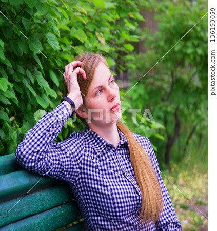 Young pretty girl on the bench 136193059