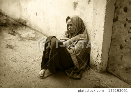 Frozen girl sitting on the floor Frozen girl sitting on the floor 136193061