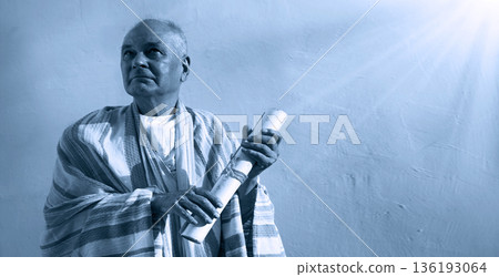 Male hand holding an old scroll Male hand holding an old scroll 136193064