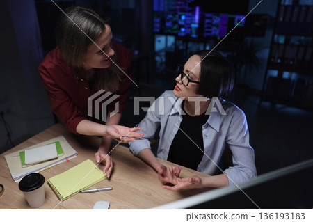 Collaboration in a modern workspace sparks great ideas during a late-night brainstorming session filled with creativity and passion Collaboration in a modern workspace sparks great ideas during a late-night brainstorming session filled with creativity and passion 136193183