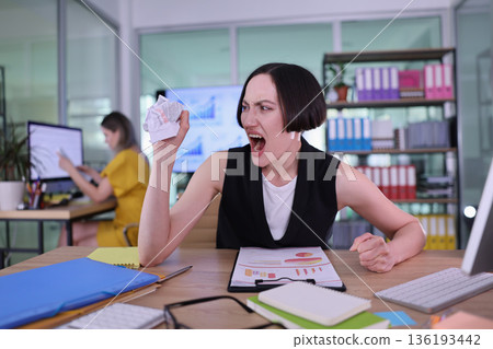 Frustration mounts in a creative office as stress takes over during a busy workday 136193442