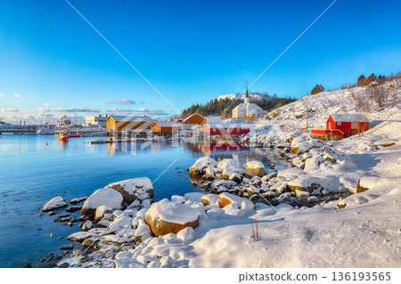 Outstanding winter scenery of Moskenes village with ferryport and famous Moskenes parish Church. Outstanding winter scenery of Moskenes village with ferryport and famous Moskenes parish Church. 136193565