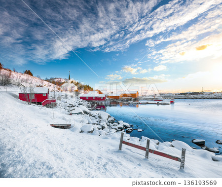 Outstanding winter scenery of Moskenes village with ferryport and famous Moskenes parish Church. Outstanding winter scenery of Moskenes village with ferryport and famous Moskenes parish Church. 136193569