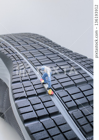 Miniature Skateboarder Riding Down Ridge Of Giant Shoe 136193912