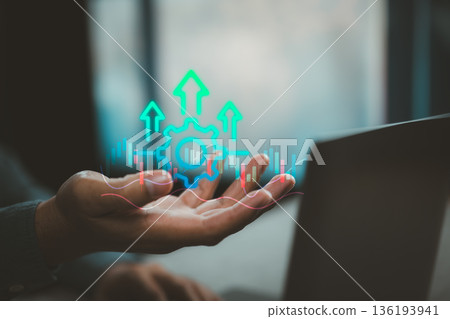 Businessman Hand Showing Gear and Growth Arrows with Financial Chart Overlay 136193941
