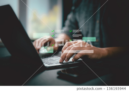 Person working on laptop with AI assistant and command prompt interface on a dark desk 136193944