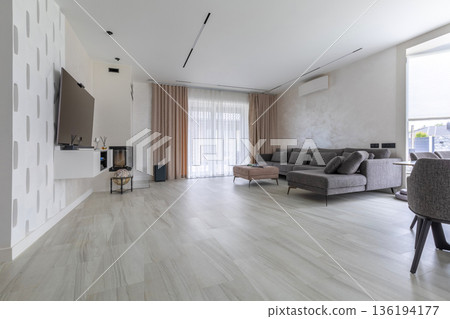 Spacious Modern Living Room with Large Sofa and TV Entertainment Area Spacious Modern Living Room with Large Sofa and TV Entertainment Area 136194177