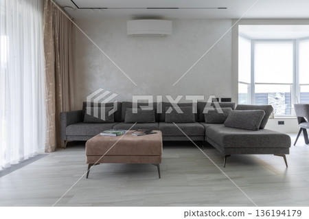 Modern Minimalist Living Room Interior with Large Sectional Sofa Modern Minimalist Living Room Interior with Large Sectional Sofa 136194179