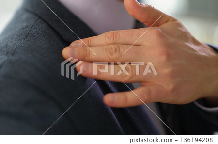 Elegant tailoring moment captured during a professional fitting session at a stylish boutique in the heart of the city 136194208