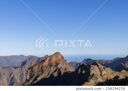 PR1 hiking trail ridges on Madeira rise above Curral das Freiras and deep green valleys below PR1 hiking trail ridges on Madeira rise above Curral das Freiras and deep green valleys below 136194258